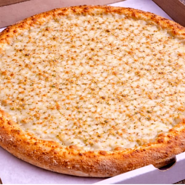 A whole white pizza with a golden crust, sprinkled with herbs, in a cardboard box.